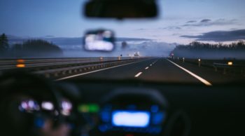 a man driving a car at night