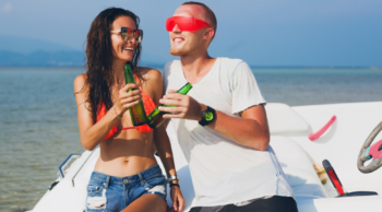 man and woman drinking and boating