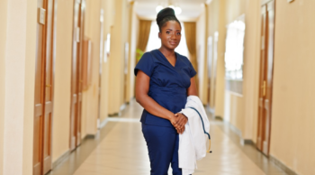 a nurse standing in the hospital hallway