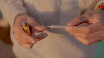 A parent preparing to light a joint